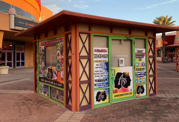 A vibrant, colorful kiosk with promotional window decals.