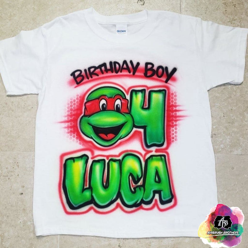 https://airbrushbrothers.com/cdn/shop/products/airbrush-airbrush-birthday-boy-ninja-turtle-shirt-design-airbrush-brothers-shirt-custom-spray-paint-design-shirt-hat-shoes-outfit-graffiti-t-shirts-birthday-90s-80s-28231888339022_800x.jpg?v=1687540427